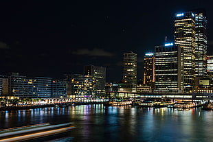 photo of buildings with lights during night time, sydney HD wallpaper