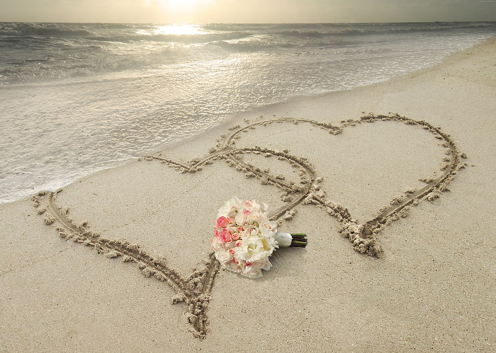 white and pink chrysanthemums bouquet on white sand with two hearts on seashore at daytime HD wallpaper