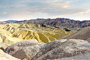 landscape photography of yellow and gray hills