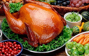 roasted whole chicken on green leafy vegetables on white ceramic plate HD wallpaper