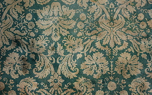 green and white floral textile