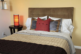 beige, red, and black comforter set