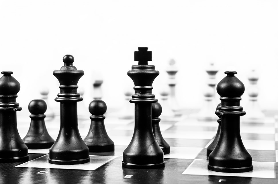 shallow photography of black chess pieces HD wallpaper