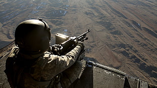 soldier holding machine gun HD wallpaper