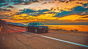 black Audi A4 along highway during golden hour HD wallpaper