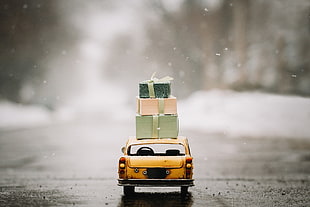 yellow vehicle scale model, miniatures, snow, presents, car HD wallpaper