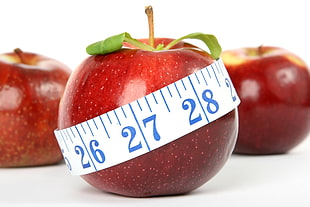 red Apple fruit wrapped with tape measure HD wallpaper
