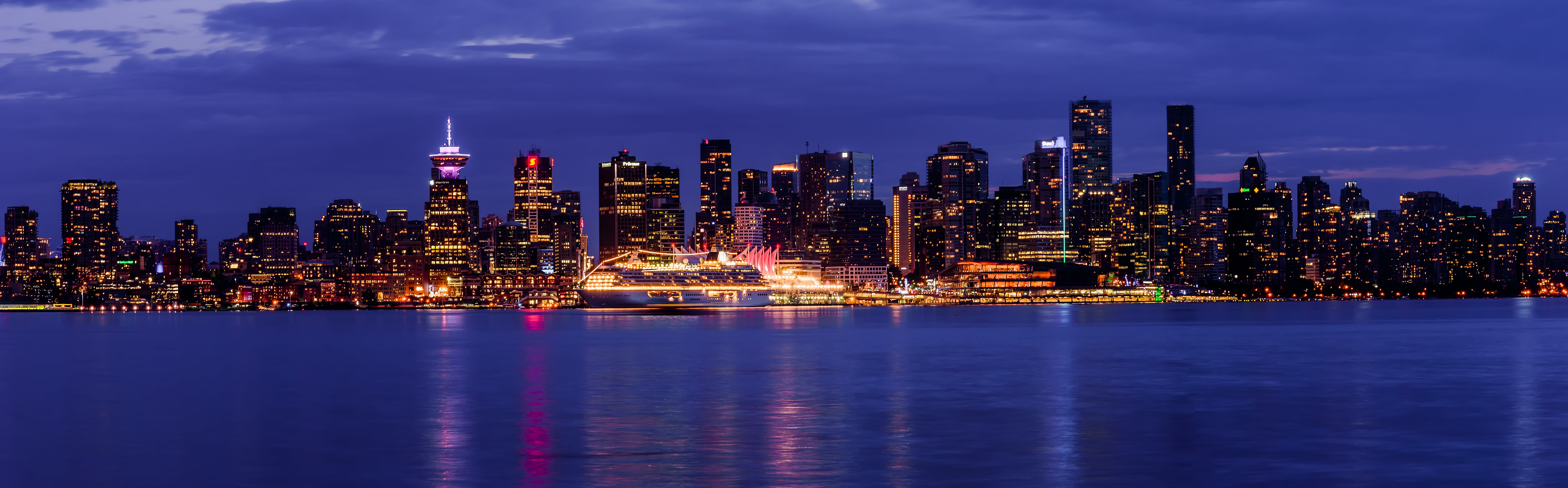 lighted building near blue body of water photo