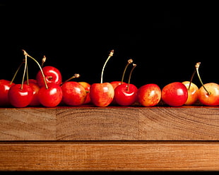 red apple lot on brown wooden table