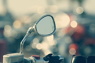 selective focus photography of motorcycle side mirror