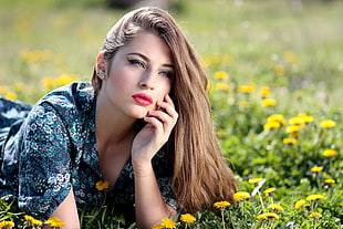 woman planking on yellow petaled flower field on selective focus photography