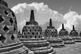 grayscale photography of cone monuments