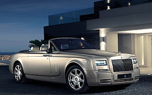 silver convertible car parked in front of house