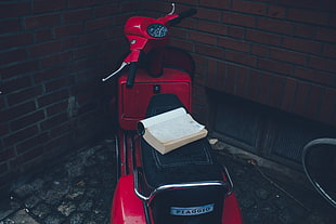 black and red motor scooter