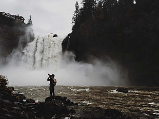 gray backpack, waterfall