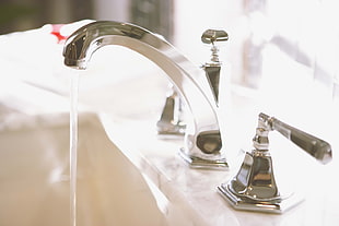 selective focus of turned on faucet