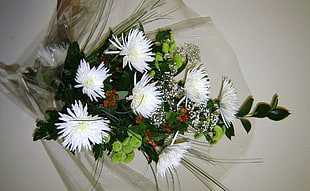white Chrysanthemums bouquet on white surface
