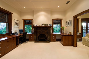 chair beside sideboard and near fireplace