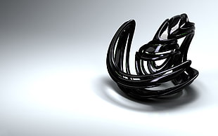 closeup photo of black accessory on white surface