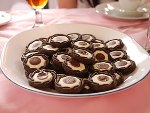 chocolate and vanilla cookies on white ceramic plate