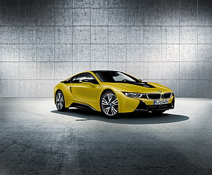 photography of yellow BMW coupe