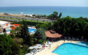 aerial photo of resort with swimming pool near beach