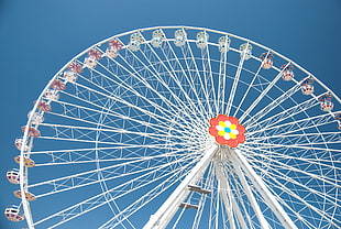 low angle photo of white ferris wheel under blue sky during daytime HD wallpaper