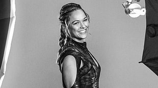 grayscale photo of woman in braided hair and black top