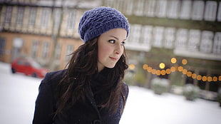 woman wearing blue knit hat and jacket