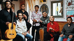 seven men gathering in the living room