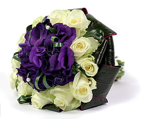 purple petaled flowers and white Rose flowers bouquet