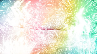 green, yellow, and orange tie-die textile