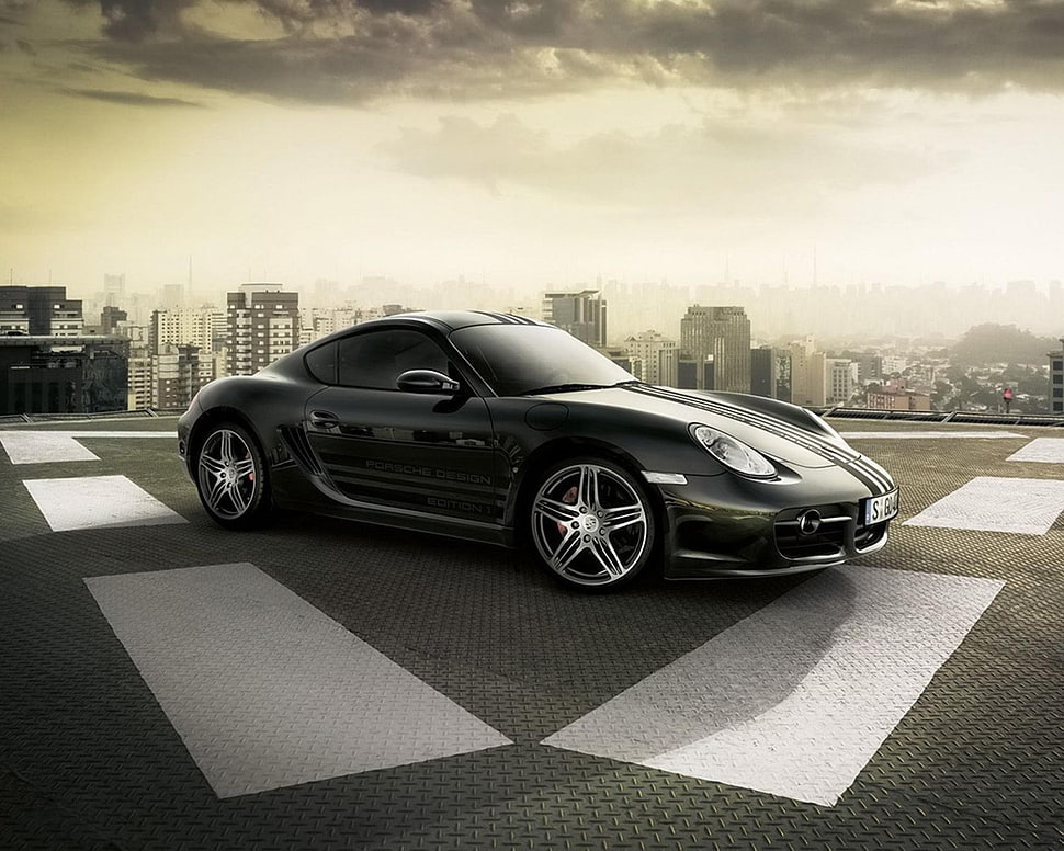 black sports car on rooftop during daytime HD wallpaper