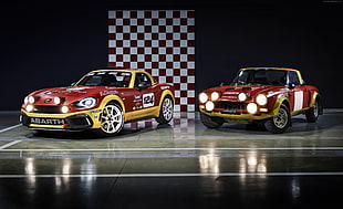 two red-and-yellow racing cars