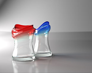 two red and blue rimmed glass bottles