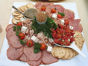 slice of ham, crackers and bacon with tomato