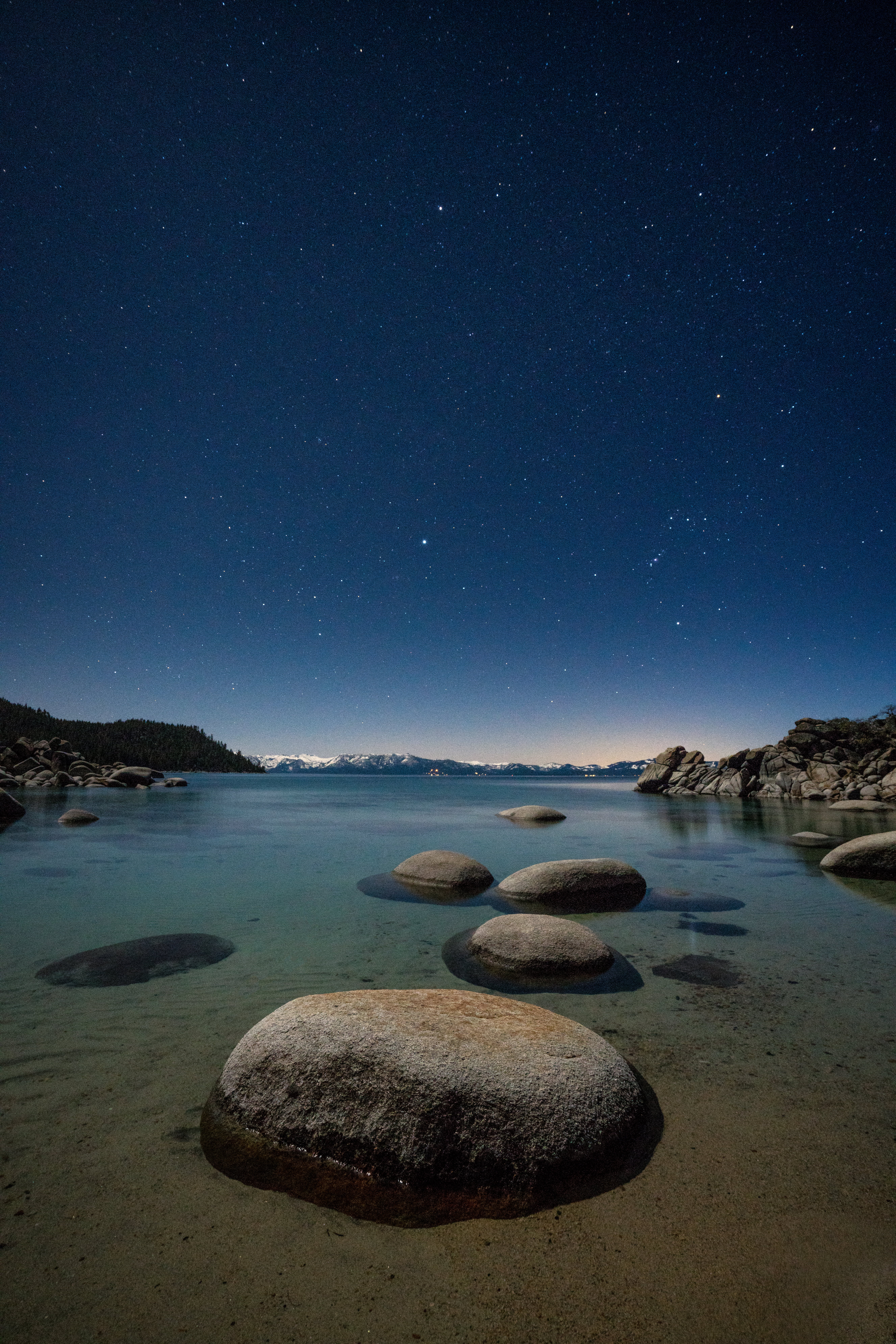 landscape photography of boulders on body of water during night time, lake tahoe