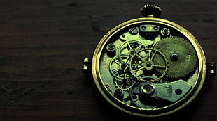 round silver-colored skeleton watch, clockwork