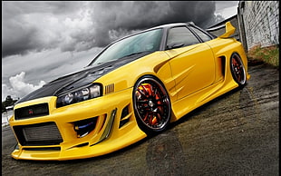 yellow Nissan Skyline coupe
