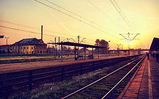 photo of train rails during sunset