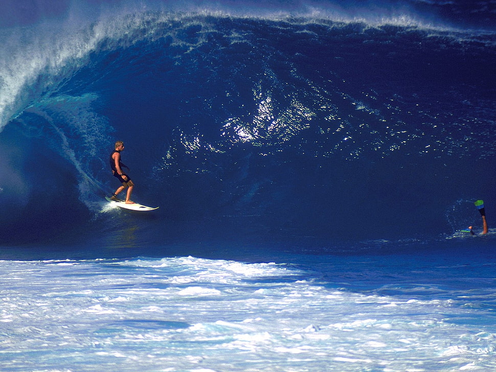 photo of man surfing during daytime HD wallpaper
