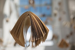 selective focus photography of floating book HD wallpaper