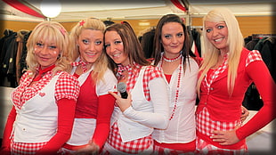 five woman wearing red and white checkered-print suits