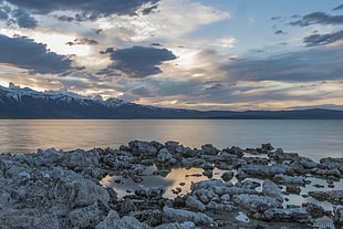 rock formation on body of water under white sky, mono lake