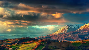 landscape photography of mountains and green field under cloudy sky illustration, landscape, nature, clouds