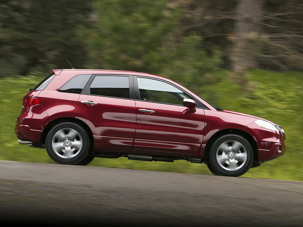 red SUV on road during daytime HD wallpaper