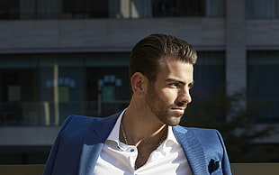 man wears blue blazer and white dress shirt