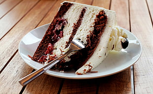 sliced cake on white plate with fork