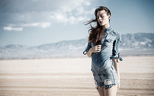 woman wearing blue denim jacket and pants on desert