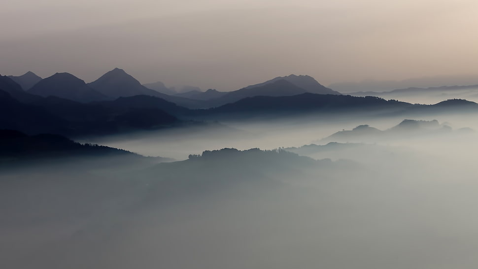black mountains surrounded by white fogs, landscape, mist, mountains, sunrise HD wallpaper